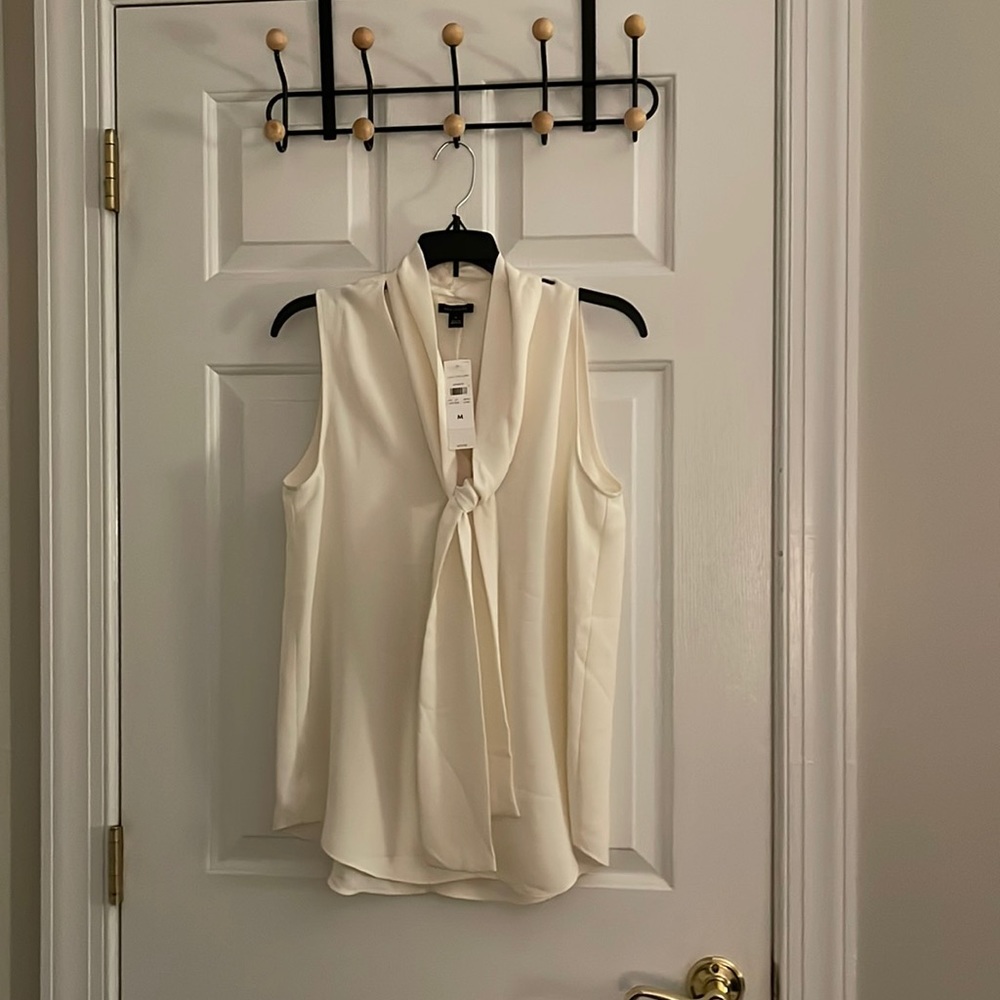 Ann Taylor shell with bow. Beautiful for any occasion. Cream. Women’s M.